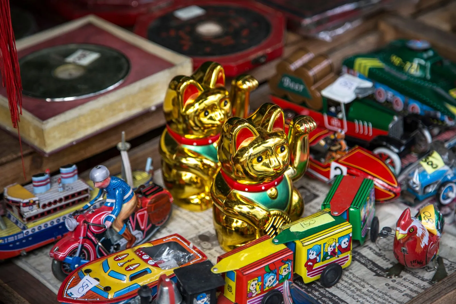 A shelf of colorful vintage toys and collectibles, evoking 90s and 2000s childhood memories